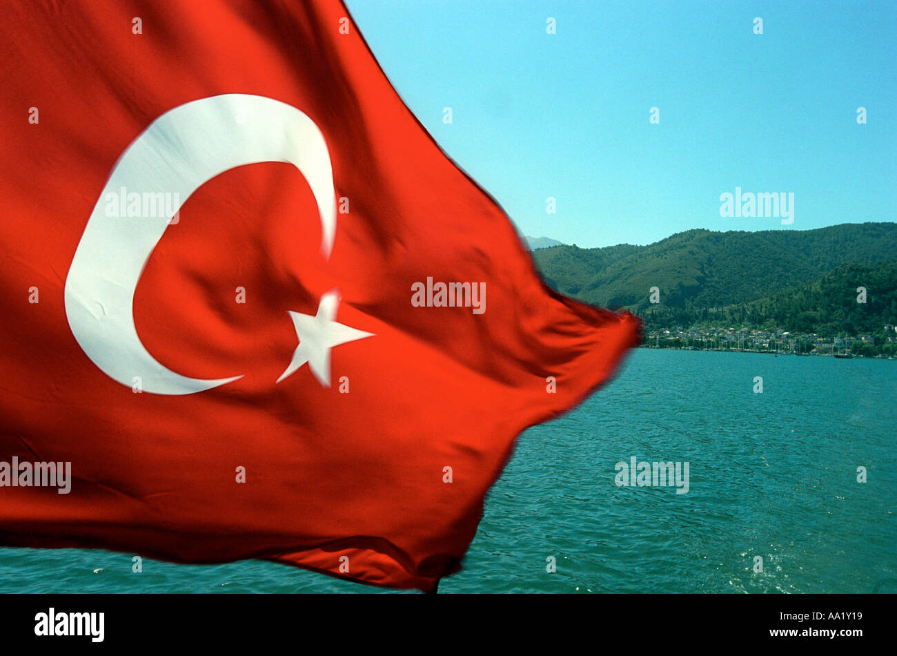 Flag of Turkey with Turkish coastline in the background Stock Photo