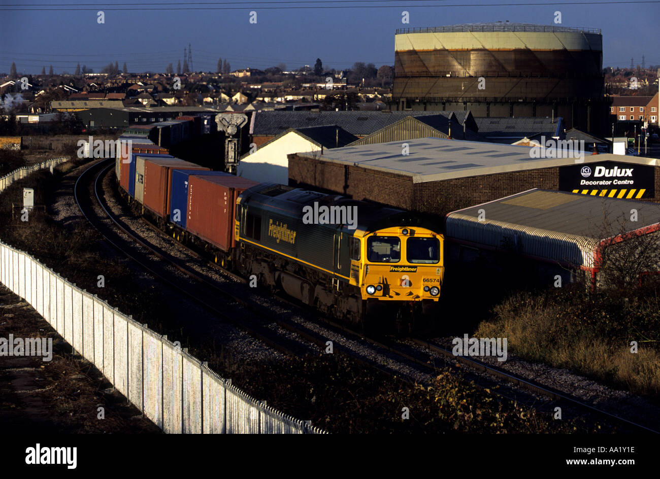 Freight train from the port of Felixstowe running through Ipswich, Suffolk, UK. Stock Photo