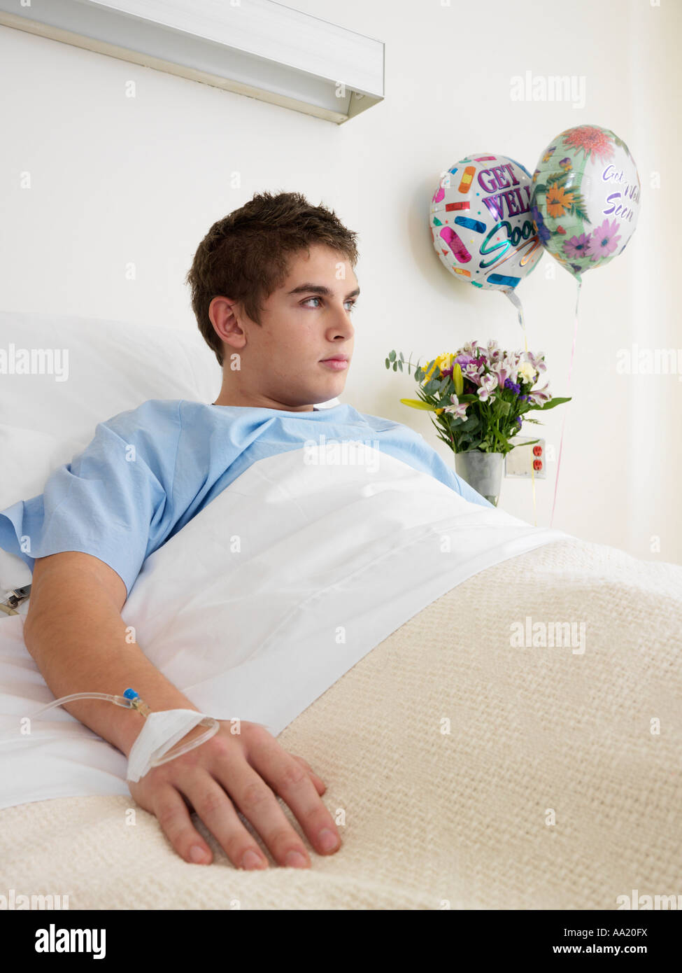 Boy in Hospital Bed Stock Photo