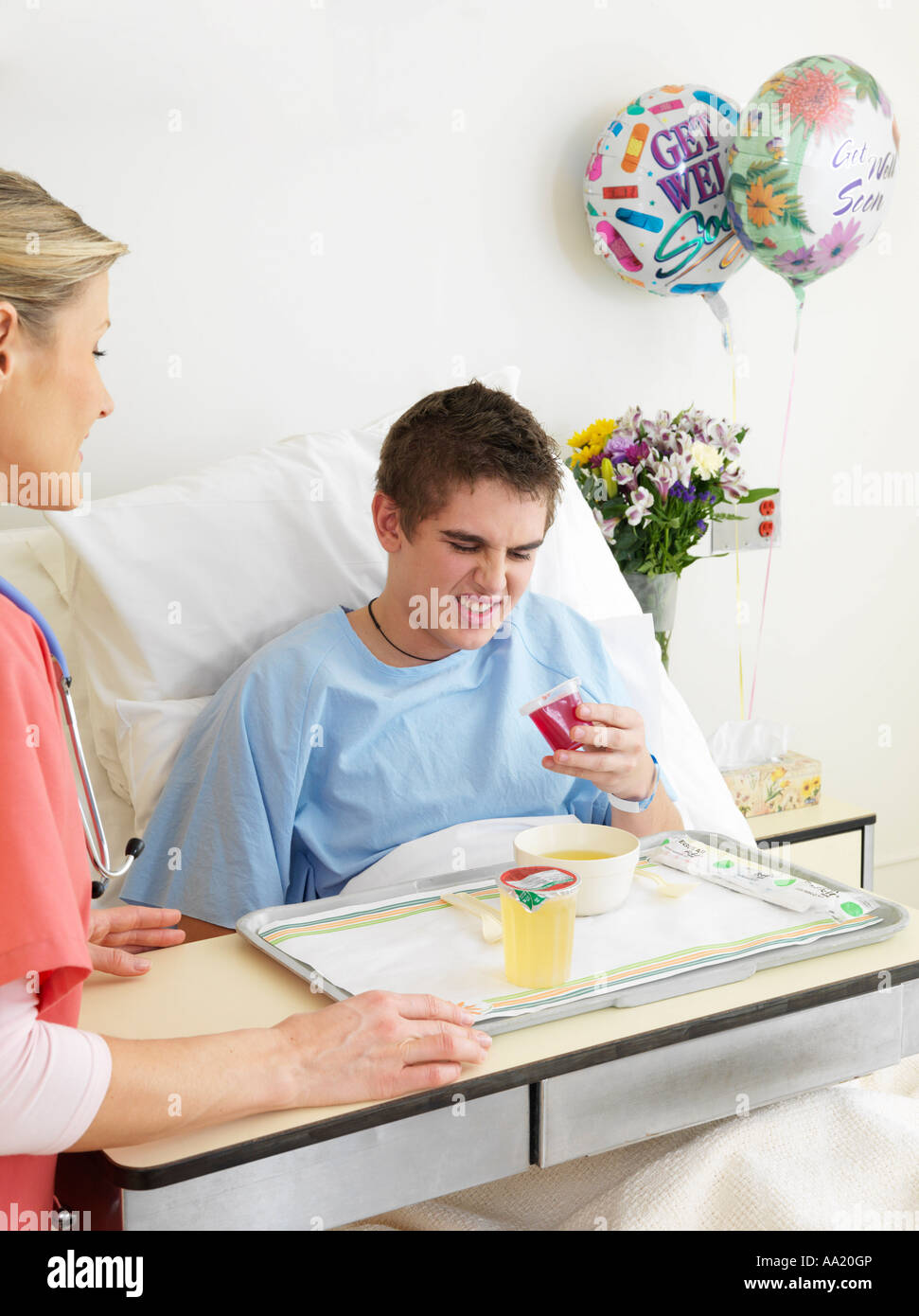 Nurse and Boy in Hospital Room Stock Photo