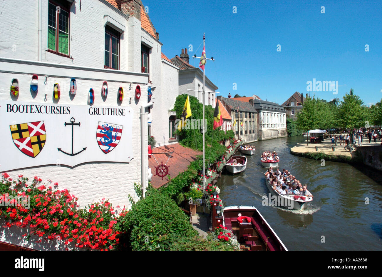 Boat trips on a canal in the old city centre, Bruges, Belgium Stock Photo