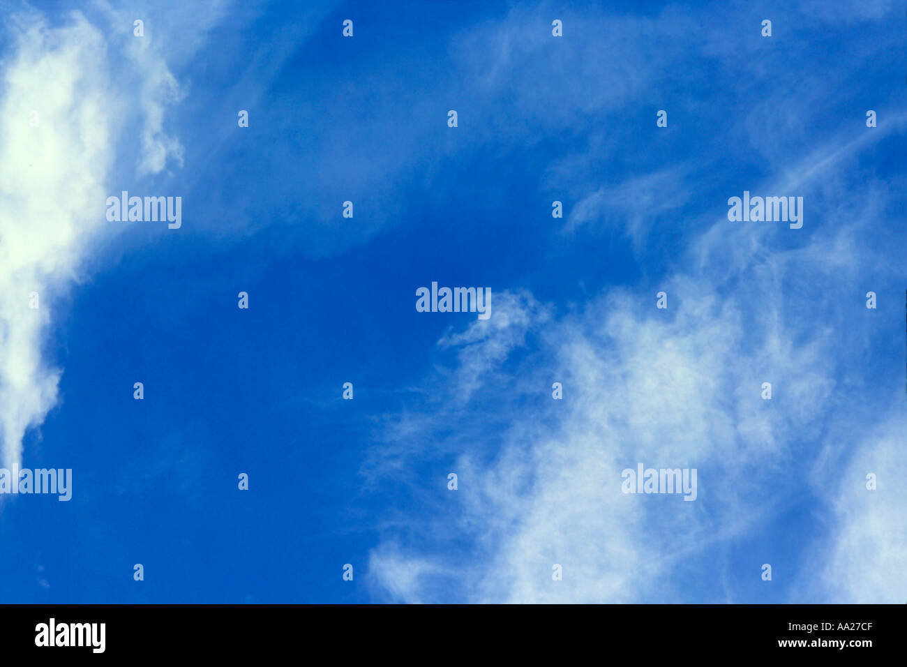 Fluffy white clouds in a blue summer sky Stock Photo - Alamy