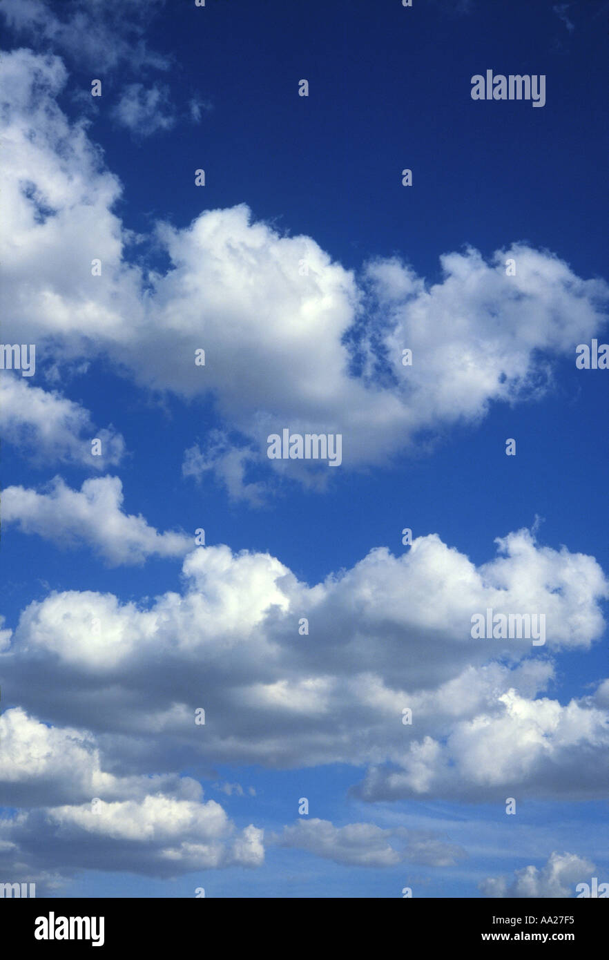 Fluffy white clouds in a blue summer sky Stock Photo - Alamy