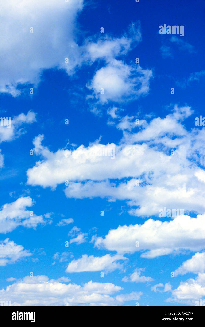 Fluffy white clouds in a blue summer sky Stock Photo - Alamy