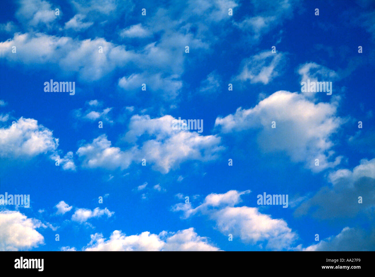 Fluffy white clouds in a blue summer sky Stock Photo - Alamy