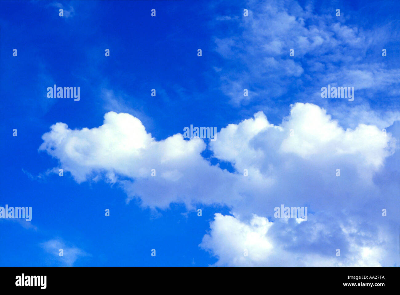 Fluffy white clouds in a blue summer sky Stock Photo - Alamy