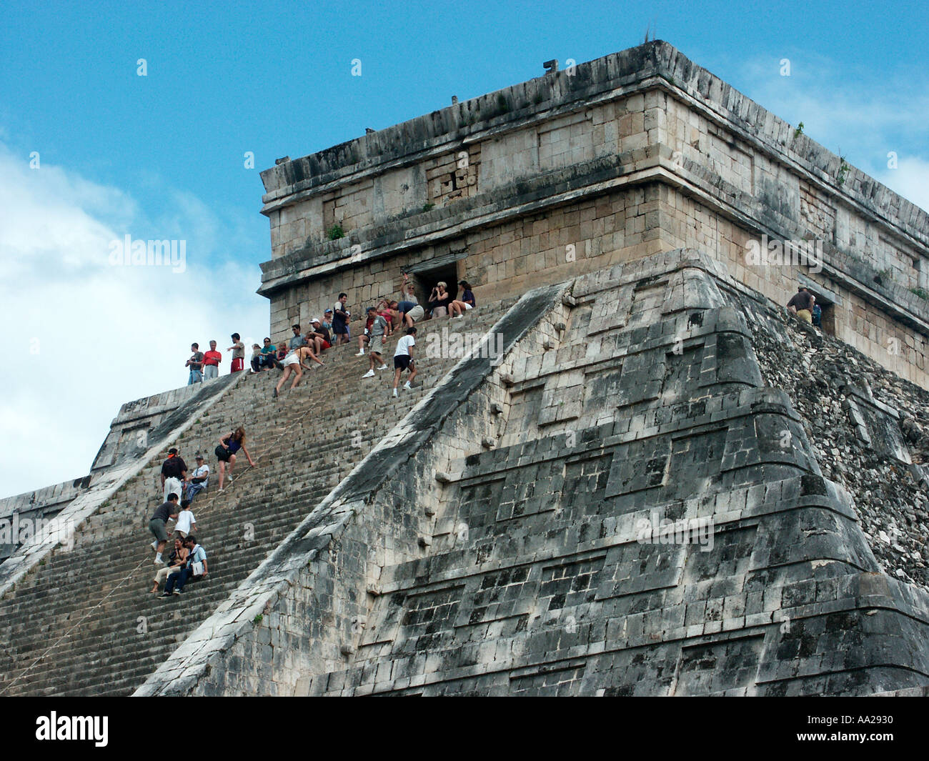 Tourists climbing the great pyramide of Chichen Itza, Mexico Stock