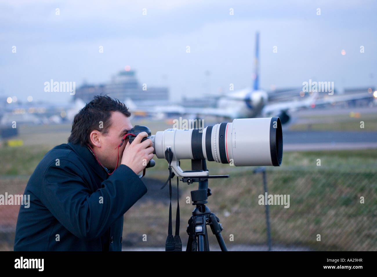 Plane spotter at airport with Stock Photo