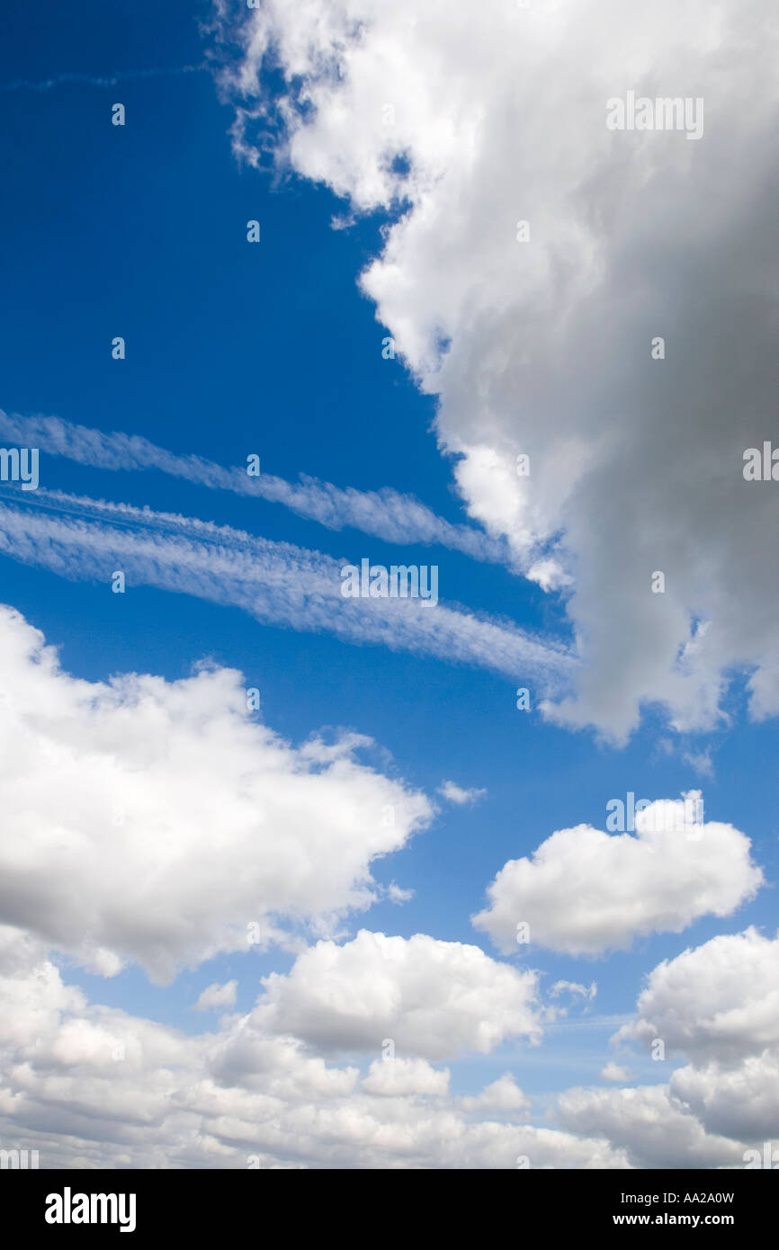 Blue sky with fluffy white clouds Stock Photo - Alamy