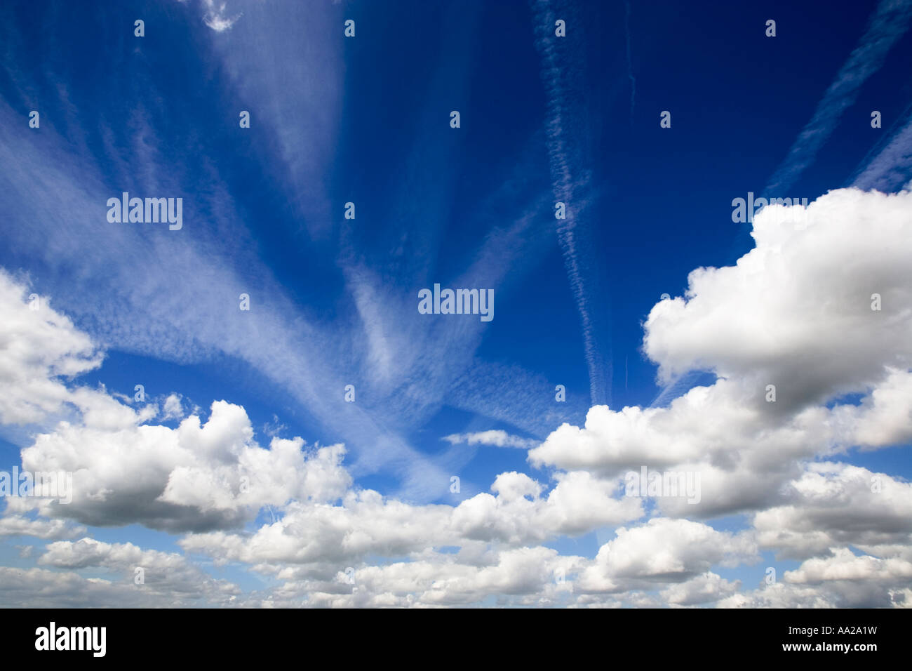 Blue sky with fluffy white clouds Stock Photo - Alamy