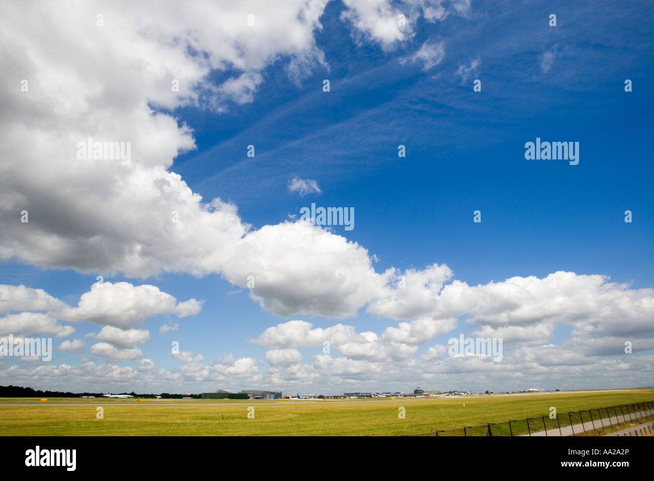 Blue sky with fluffy white clouds Stock Photo - Alamy