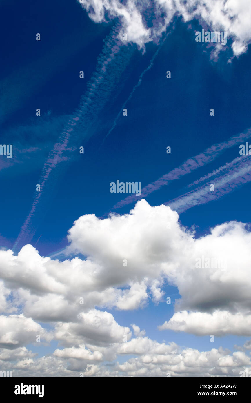 Blue sky with fluffy white clouds Stock Photo - Alamy