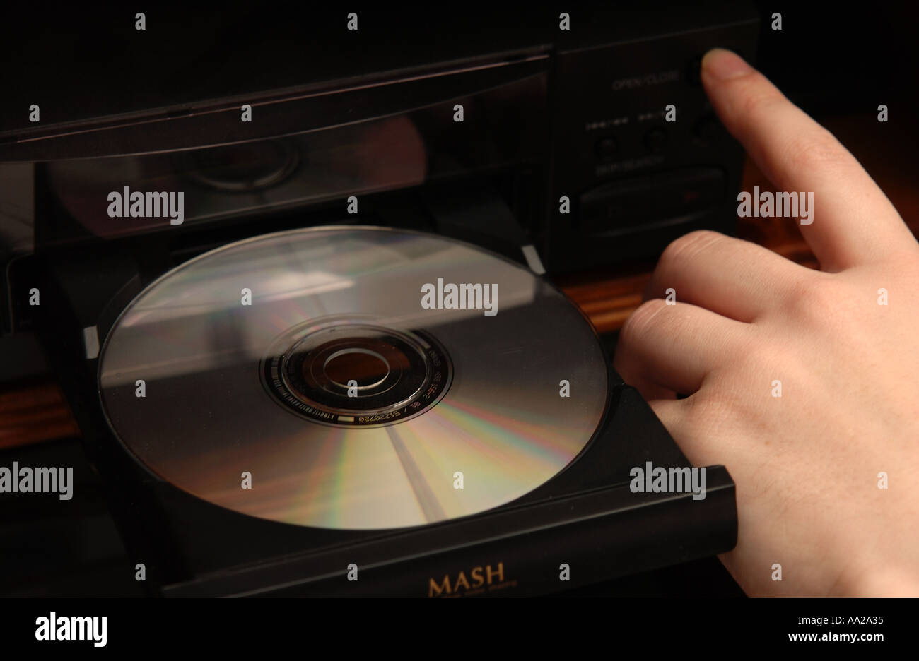 Person Putting CD Into CD Player Stock Photo Alamy