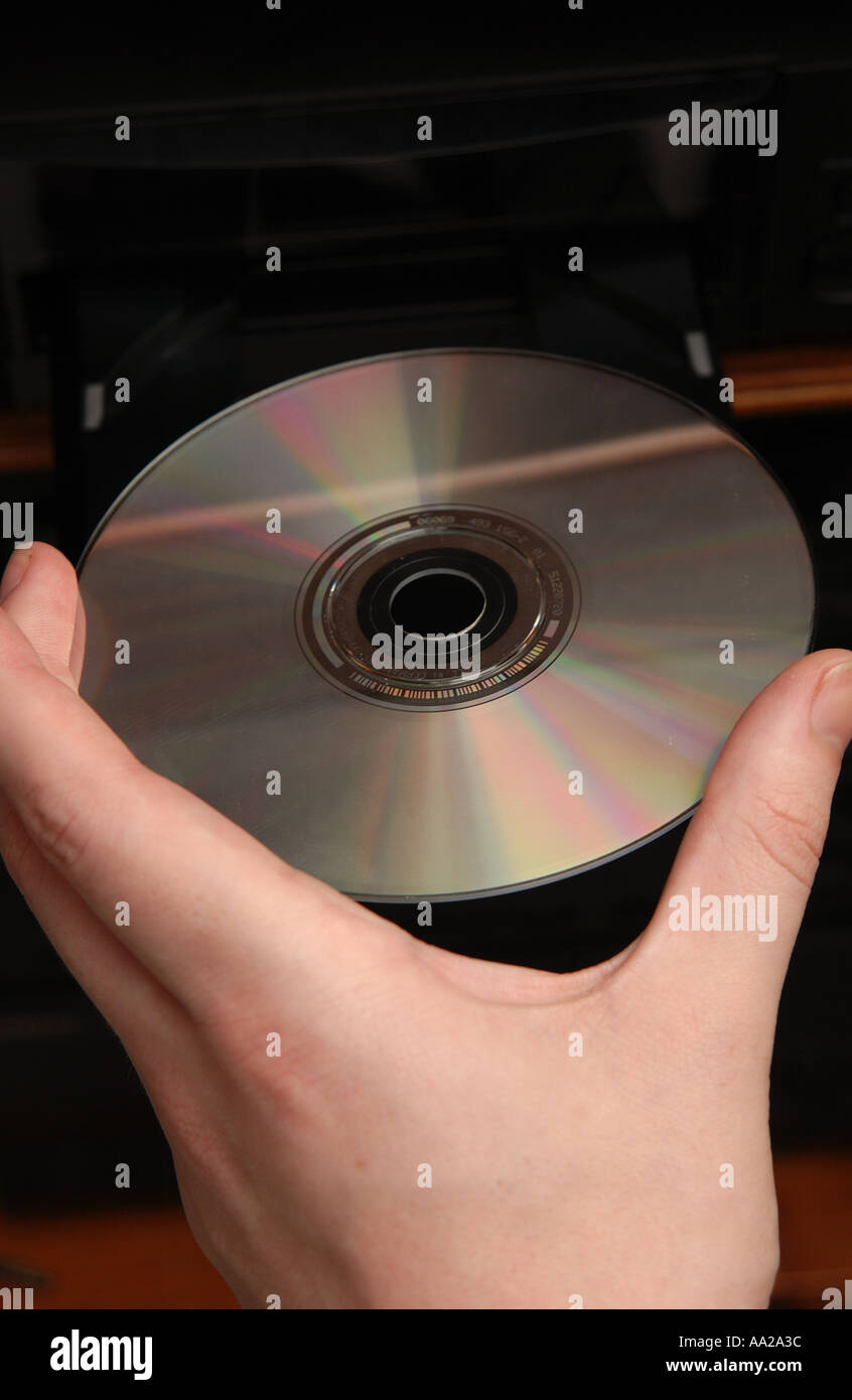 person putting cd into