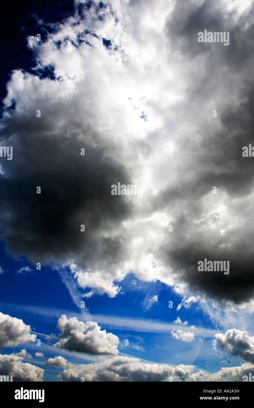 Blue sky with fluffy white clouds Stock Photo - Alamy