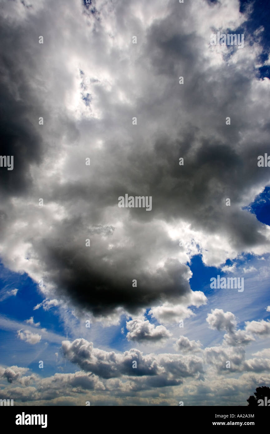 Blue sky with fluffy white clouds Stock Photo - Alamy