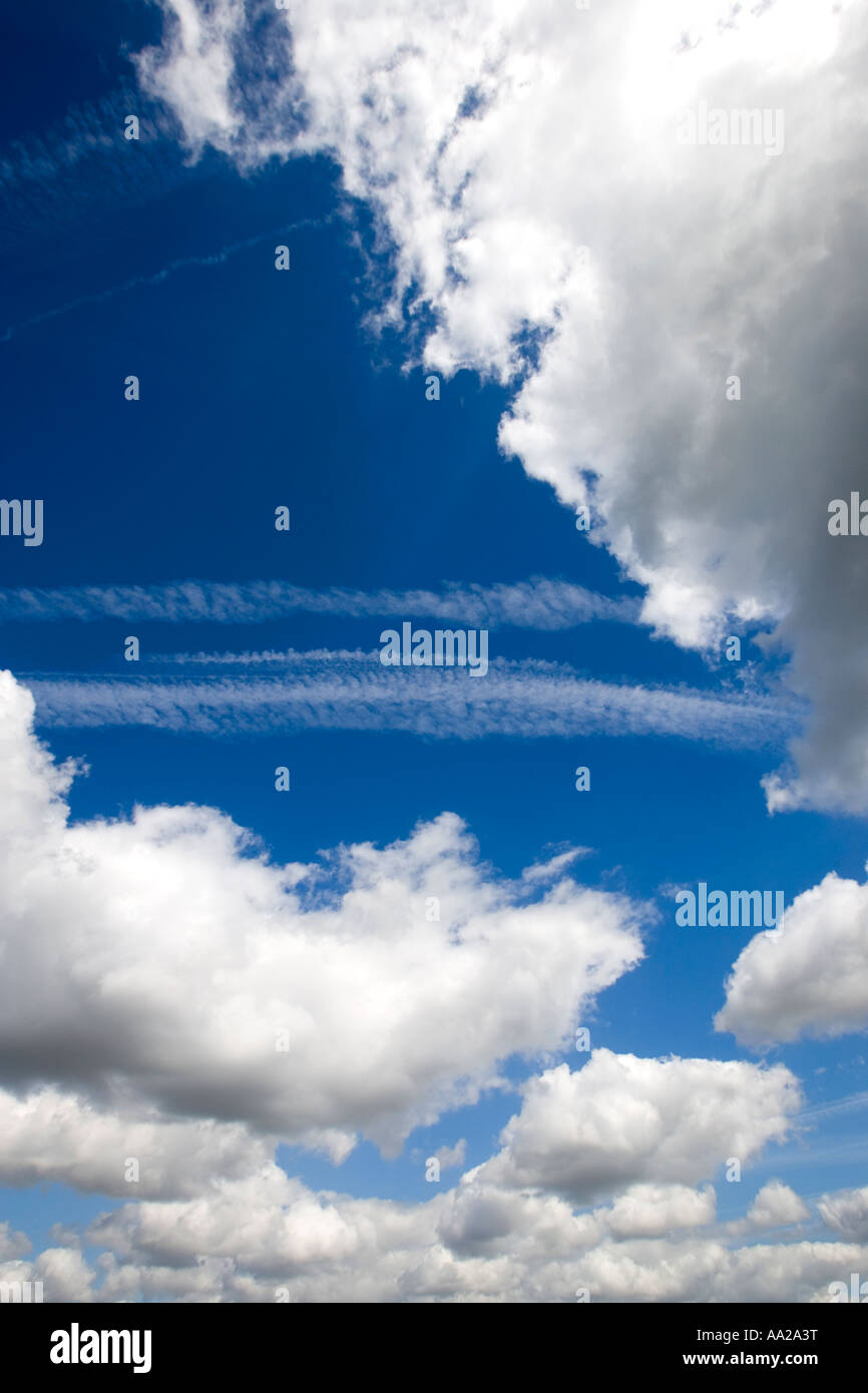 Blue sky with fluffy white clouds Stock Photo - Alamy