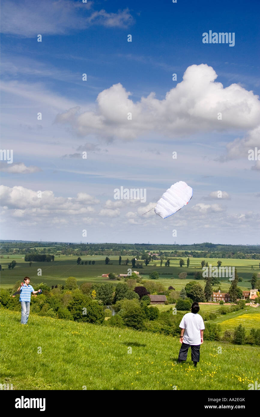 Boys flying kites on Wittenham Clump Oxfordshire Stock Photo
