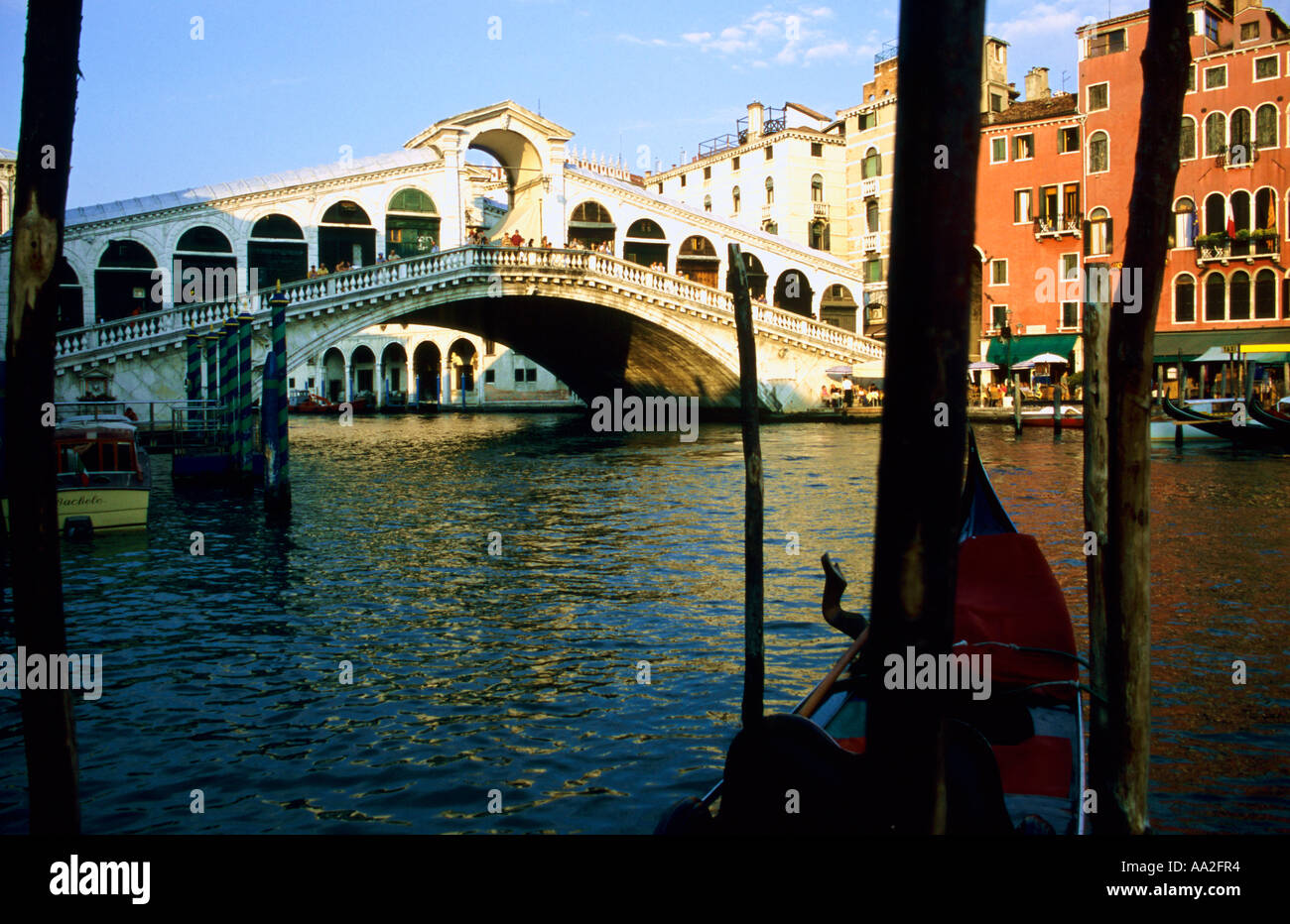 Italy, Venice, Grand Canal Ponte Rialto Bridge, Rialto Bridge, gondola and moorings in foreground Stock Photo