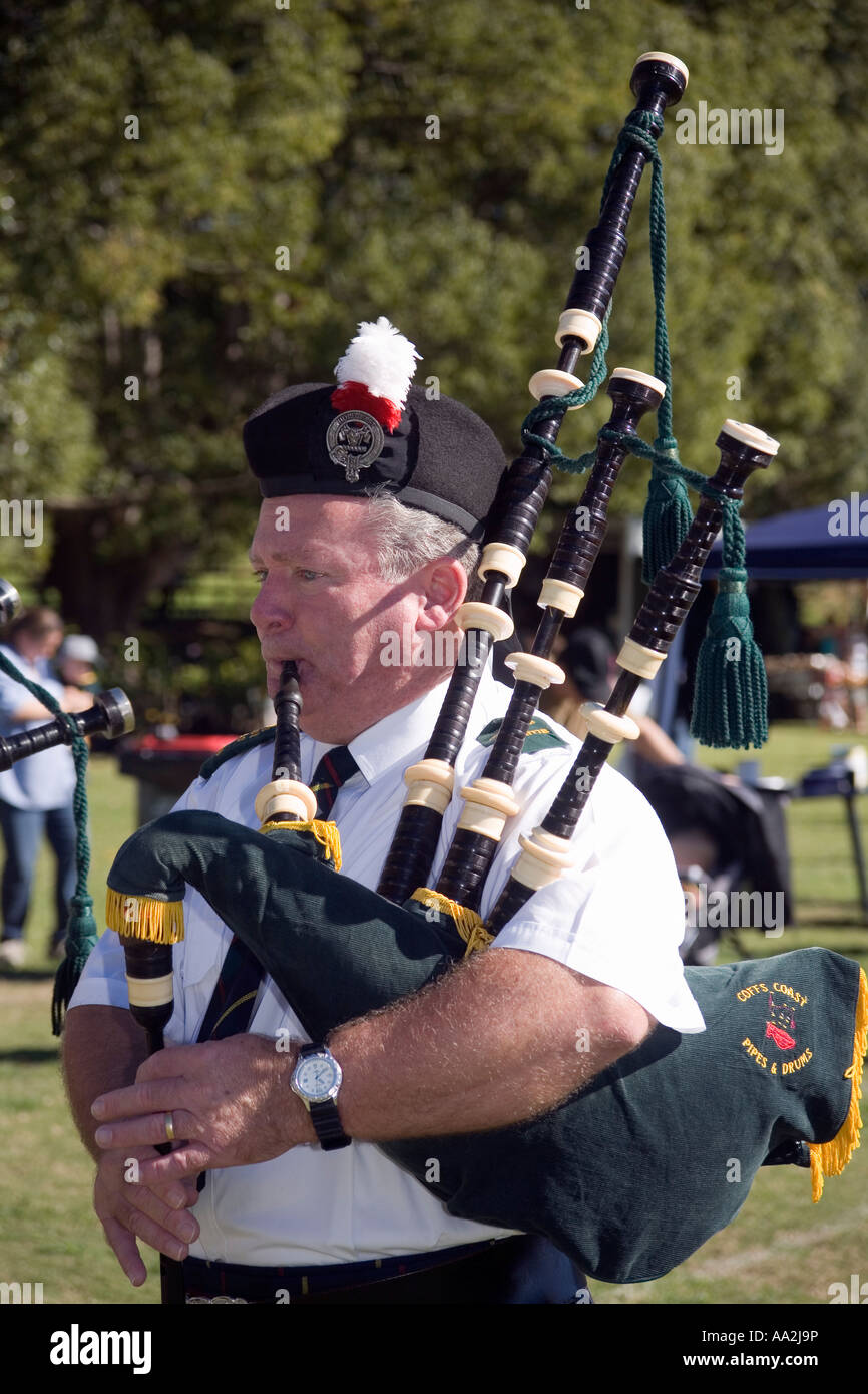 a man playing bagpipes and wearing traditional costume Stock Photo Alamy