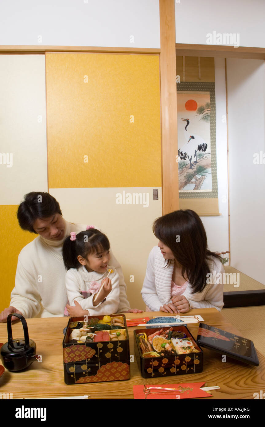 Family eating New Year s Day meal Stock Photo Alamy