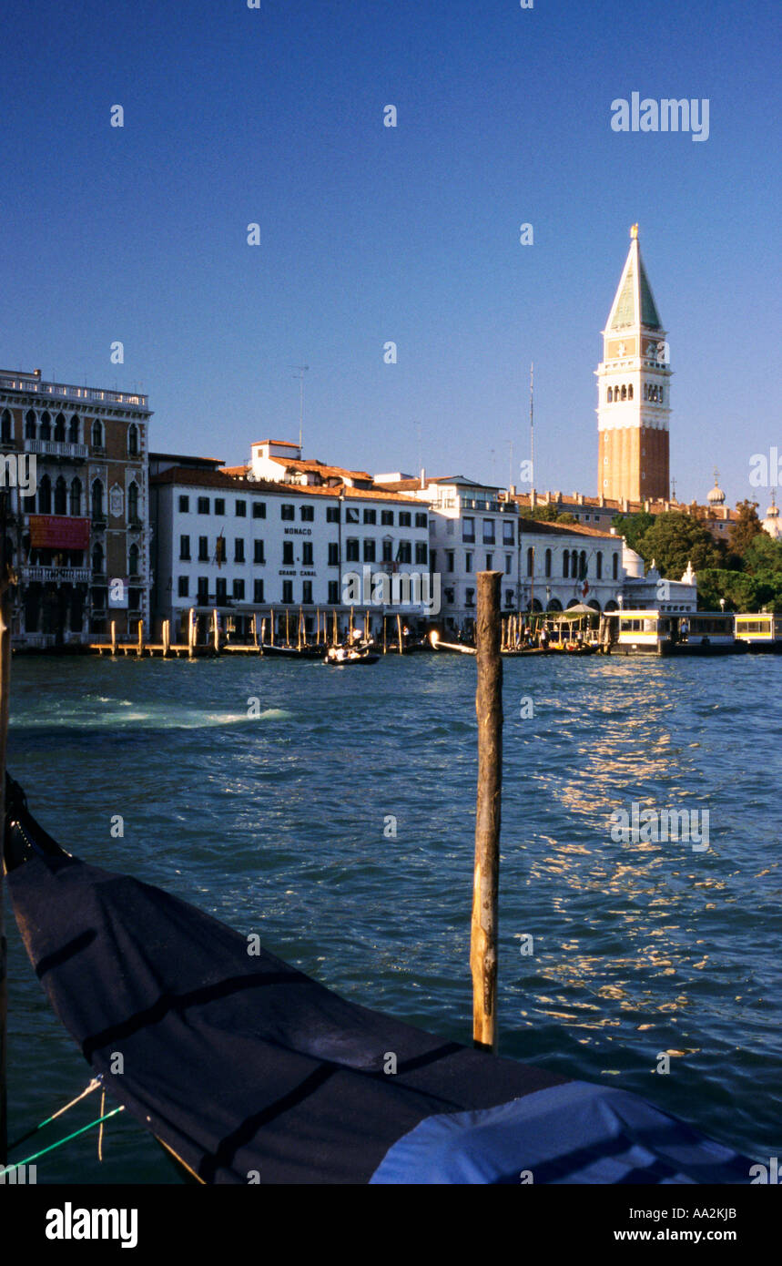 Italy, Venice, Piazza di San Marco Saint Mark square Campanile tower, St Marks tower behind gondola and lagoon Stock Photo