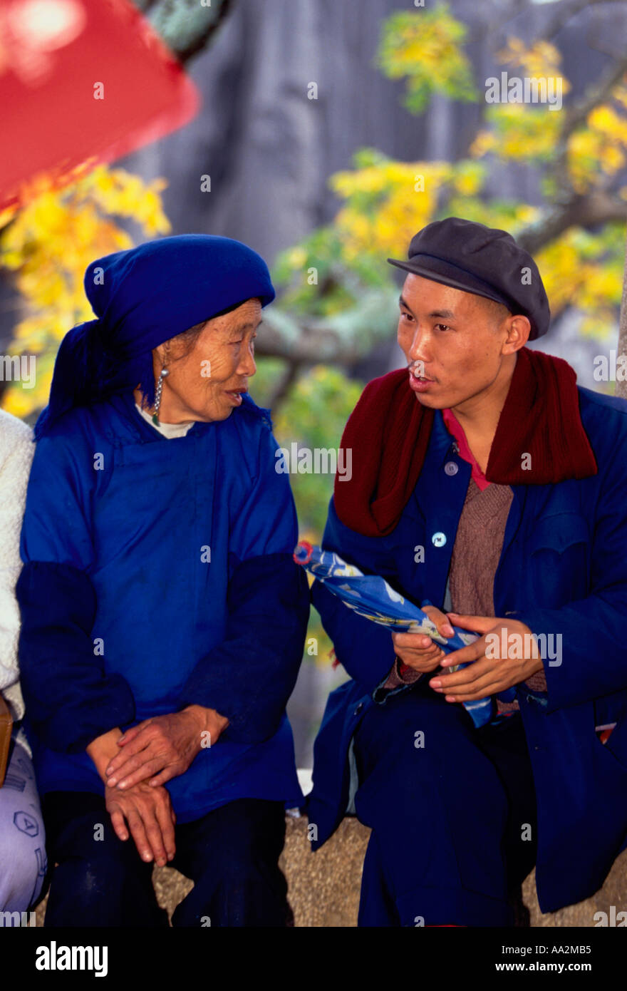 Chinese people, Sani people, Sani woman, Sani man, talking, ethnic group, ethnic minority, Shilin Stone Forest, Yunnan Province, China, Asia Stock Photo