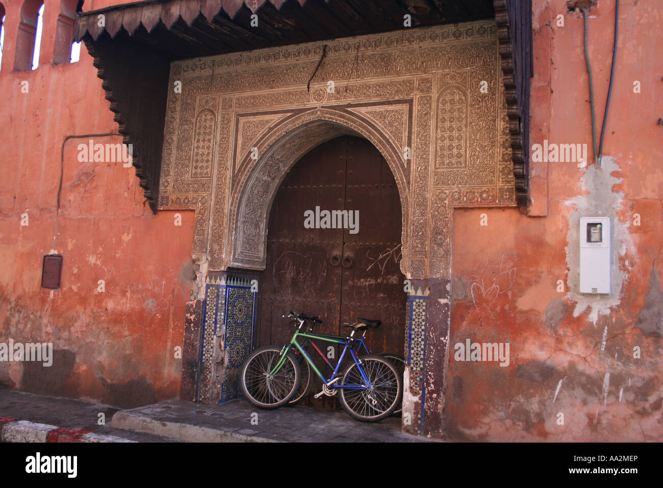 wooden door, entrance, near djemaa el-fna, square of the dead, marrakesh, morocco, north africa, doorway, bike Stock Photo