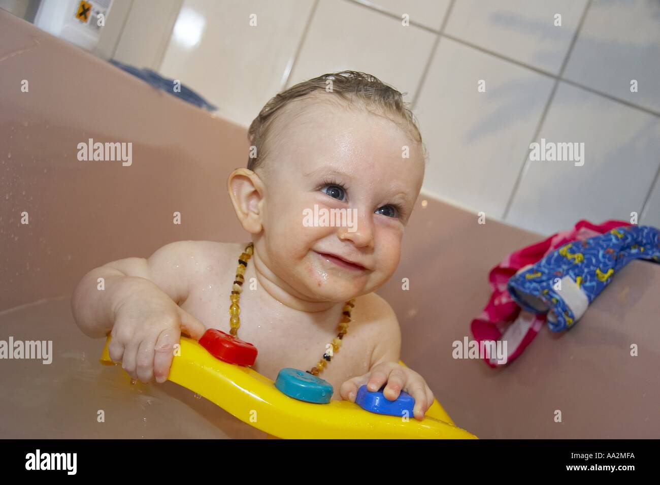 baby bathing in bath tub Stock Photo Alamy