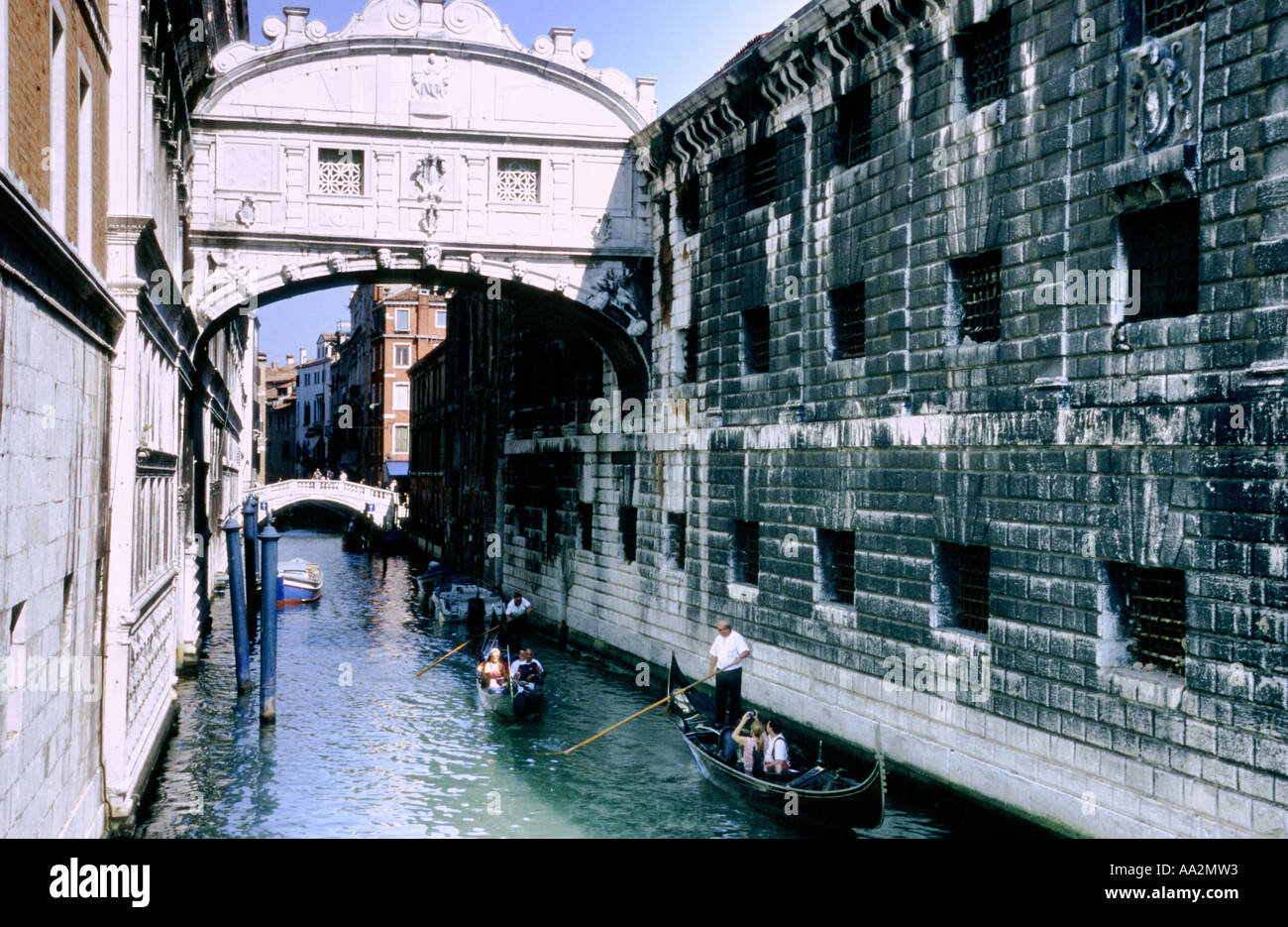 Italy, Venice, Palazzo Ducale Doges Palace and Bridge of Sighs with old prison, stone walls connected by bridge above canal with Stock Photo