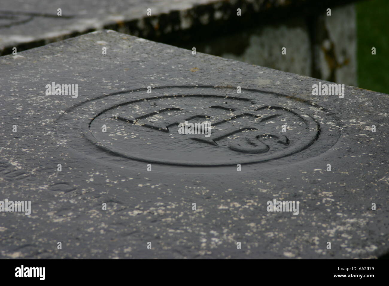 tombstone with engraved 'IHS' Stock Photo Alamy