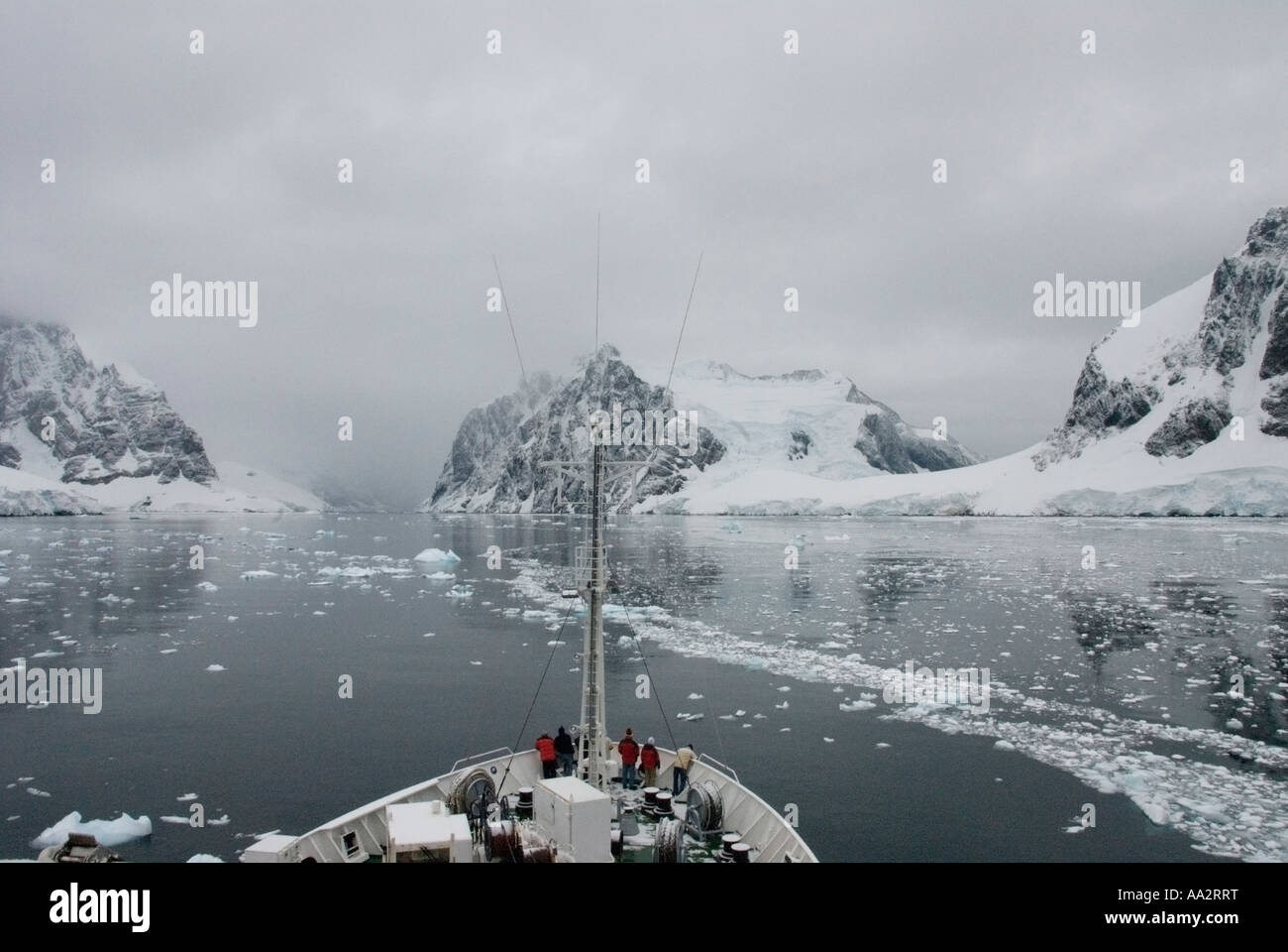 Aleksey Marishev Russian ship cruising along icy Antarctic coastline. Stock Photo