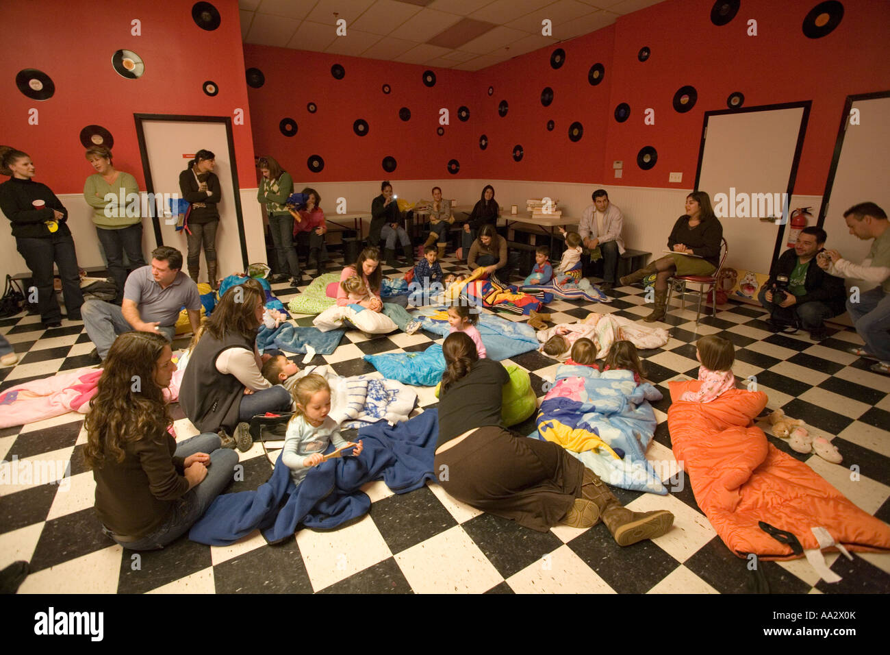 Three Year Olds Sprawled On Checkered Floor In Sleeping Bags