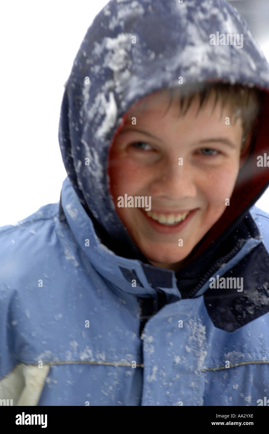 snowball fight snowing snow winter wintry weather cold freezing frozen snowy day daylight colour color playing play fun kids kid Stock Photo