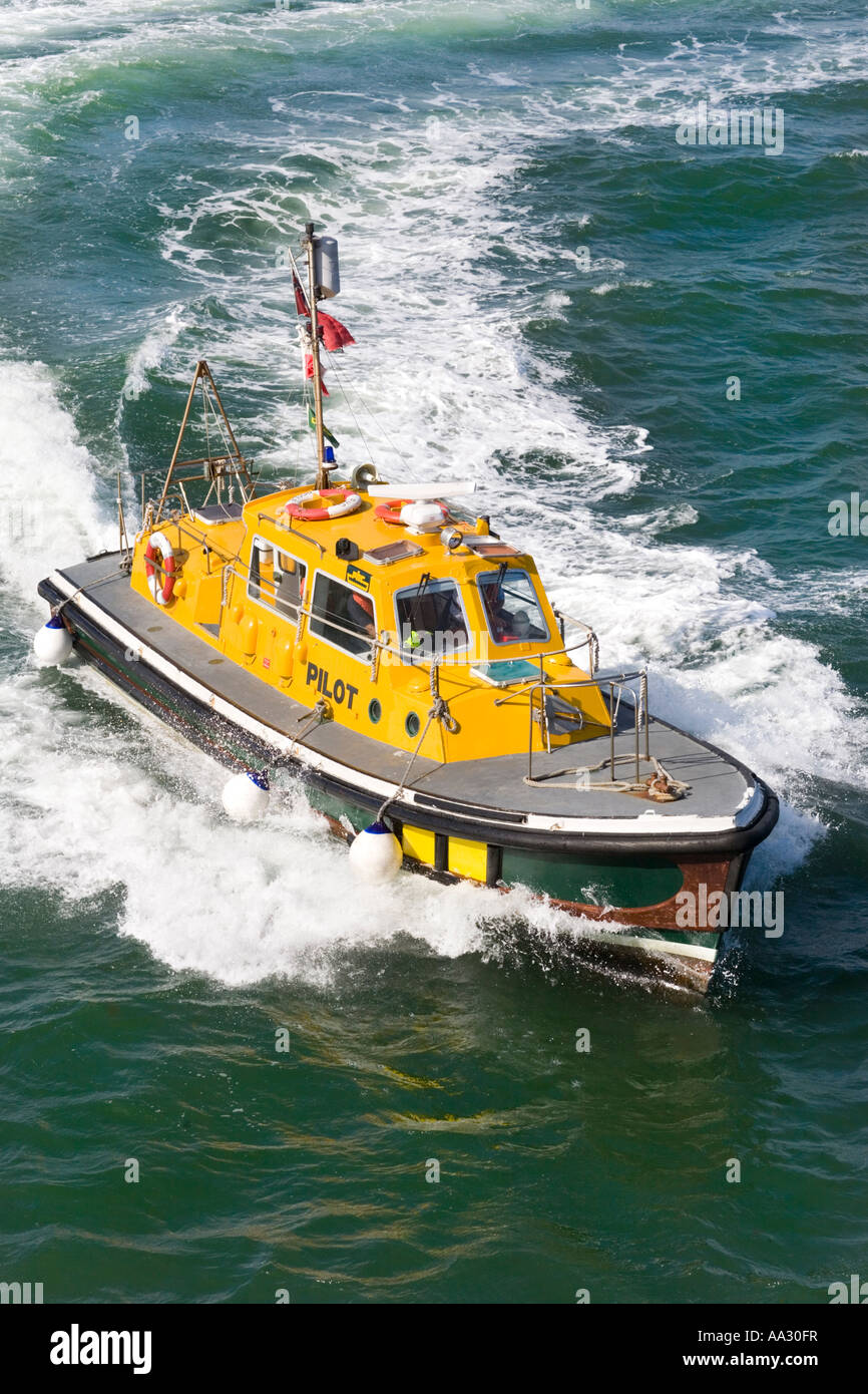 The Poole pilot launch Venture arriving to take off the pilot from an outgoing Channel Islands ferry Stock Photo