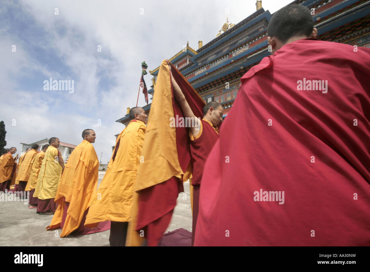 Monks prepare for morning prayers outside one of the main monastries in Darjeeling India Stock Photo