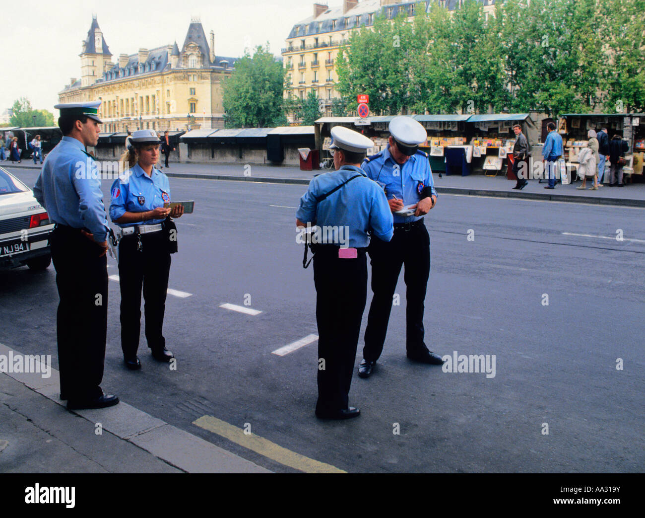 Paris Four traffic officers on the street writing parking tickets. Stock Photo