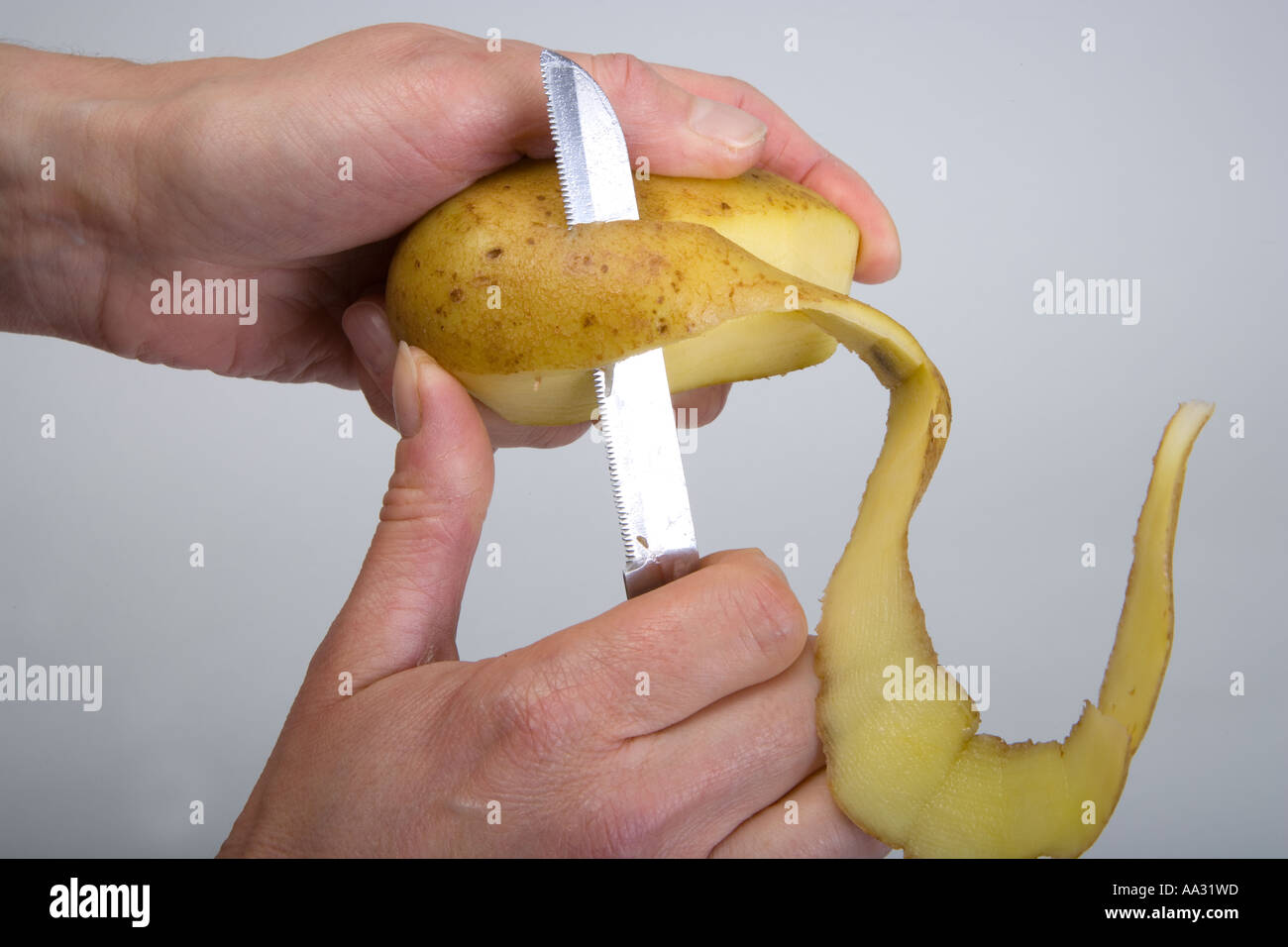 Peeling a Potato Stock Photo Alamy