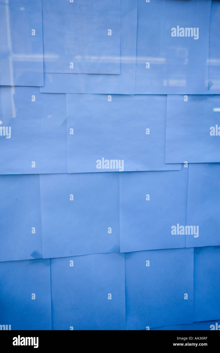 Paper forms a pattern inside a window Stock Photo