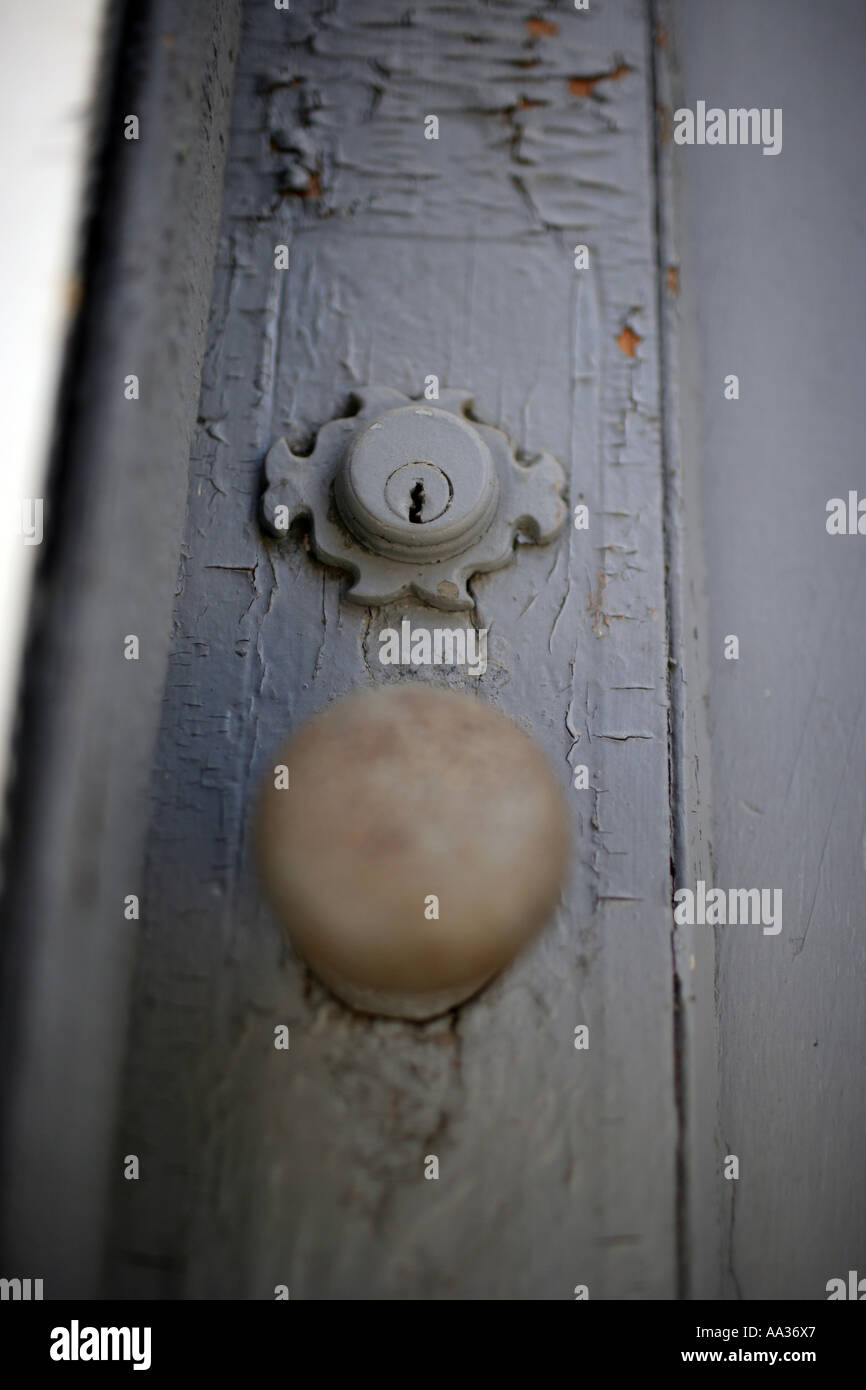 Door knob with peeling paint and lock Stock Photo Alamy