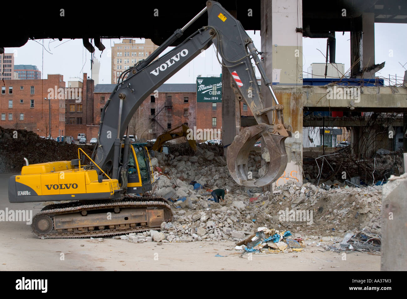 Giant Volvo backhoe loader wrecking digger tractor demolishing a large  building in New Haven Connecticut USA Stock Photo