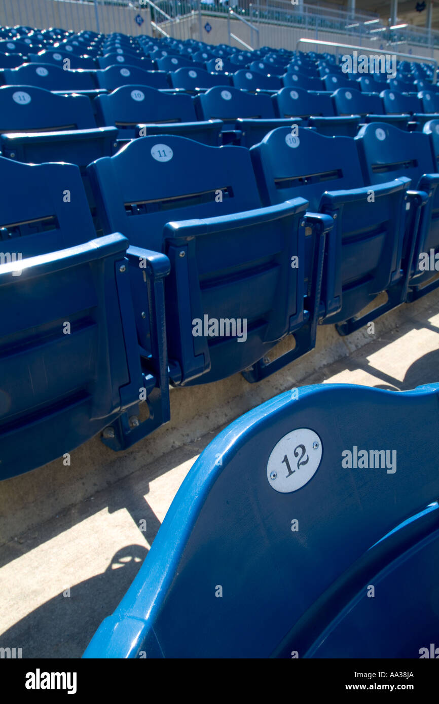 Rows of blue seats in a Minor League Baseball Stadium in the USA. Stock Photo