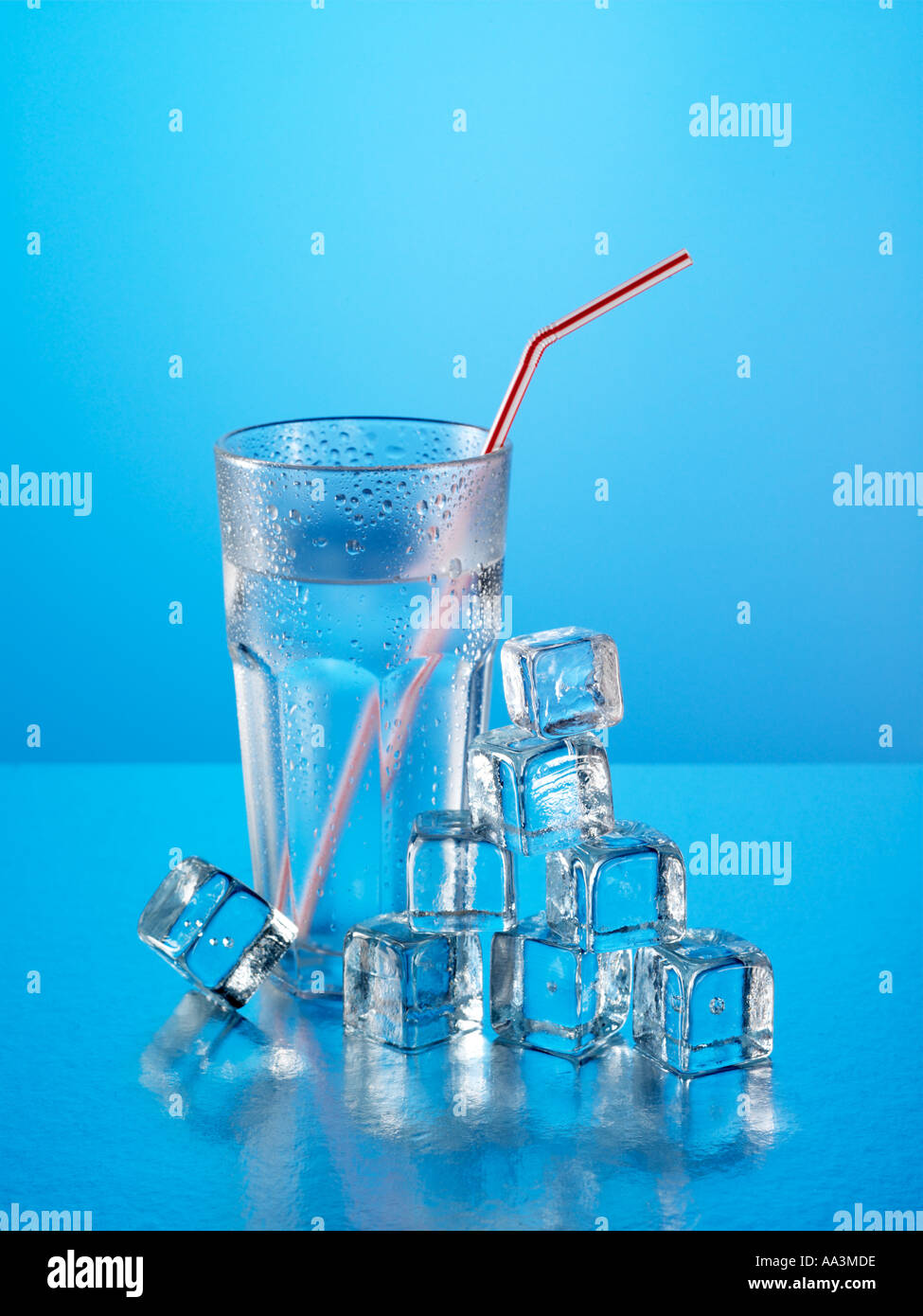 Glass of water with straw and ice cubes Stock Photo Alamy