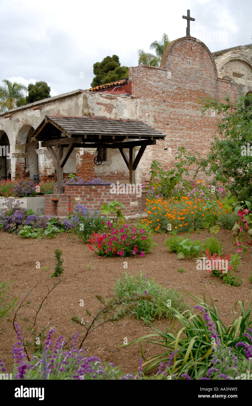 Garden and rain tank Mission San Juan Capistrano CALIFORNIA Stock Photo