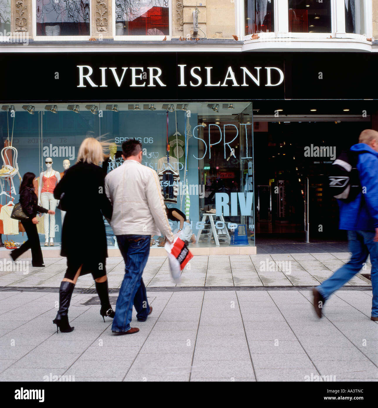 Shoppers approaching River Island retail store at Queen Street Cardiff Wales UK Stock Photo