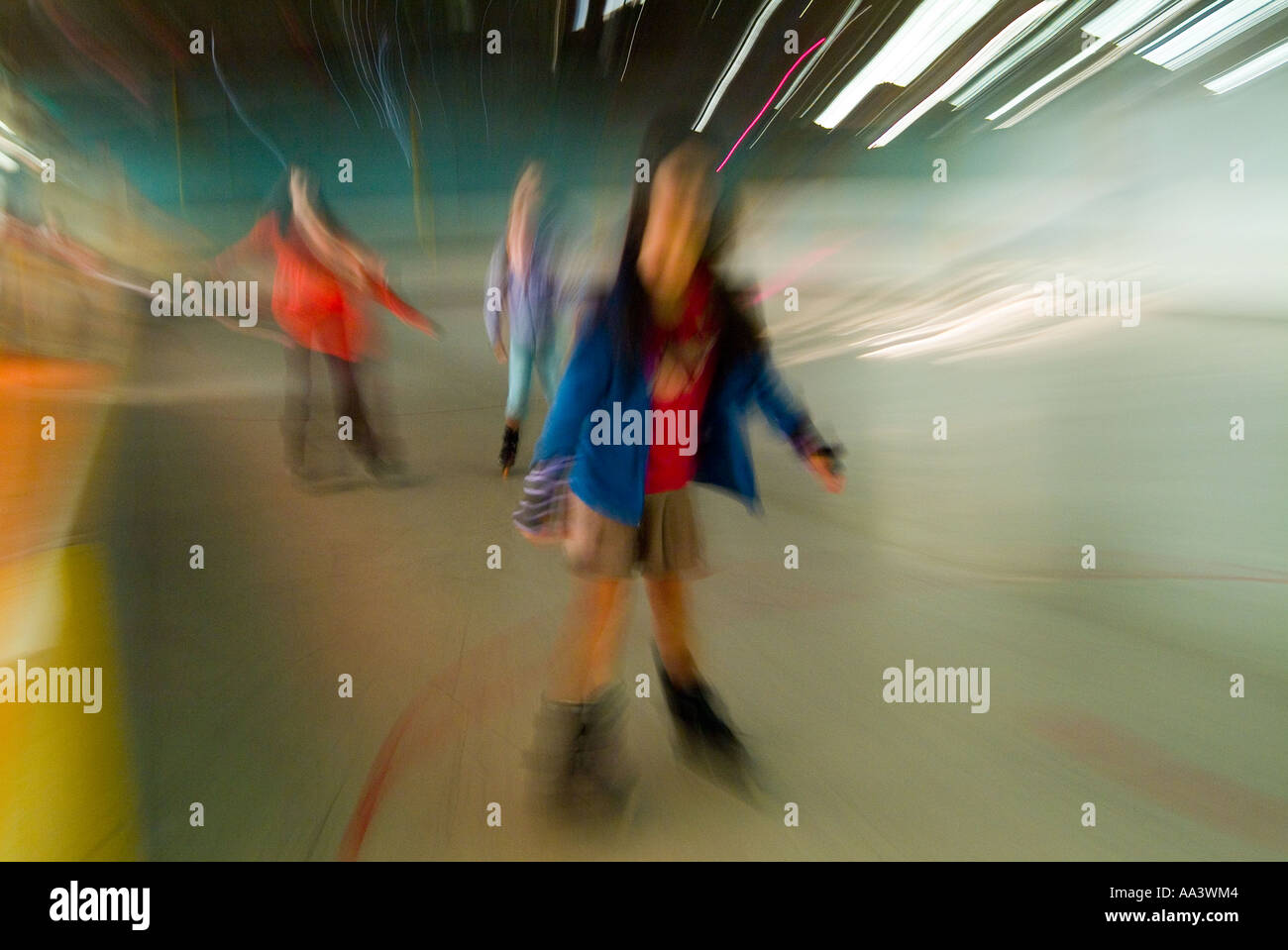 Children skating on roller blades at an indoor rink Stock Photo Alamy