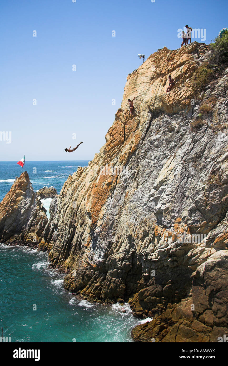 Cliff diver, a clavadista, diving off the cliffs at La Quebrada, Acapulco, Guerrero State, Mexico Stock Photo