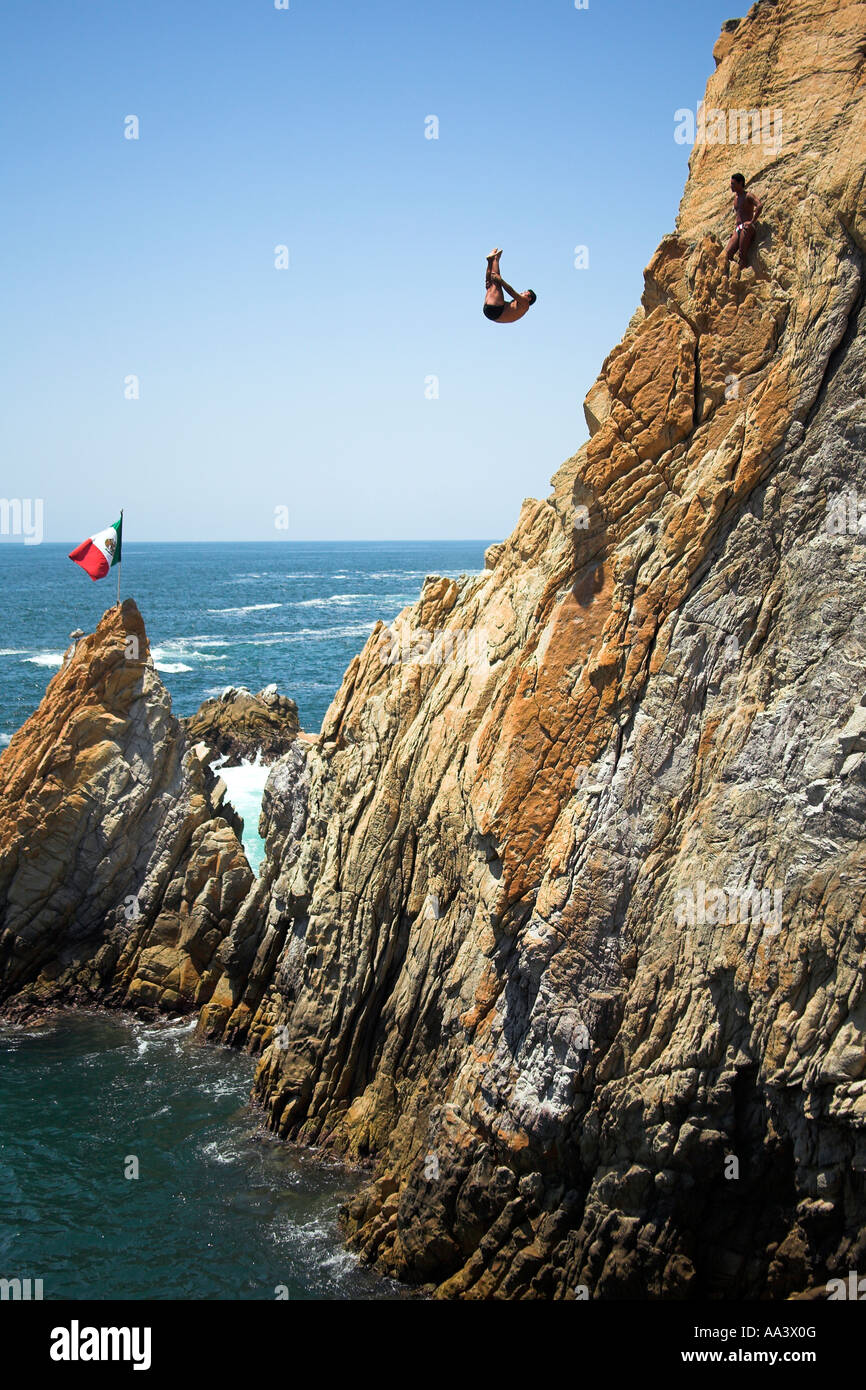 Cliff diver, a clavadista, diving off the cliffs at La Quebrada, Acapulco, Guerrero State, Mexico Stock Photo