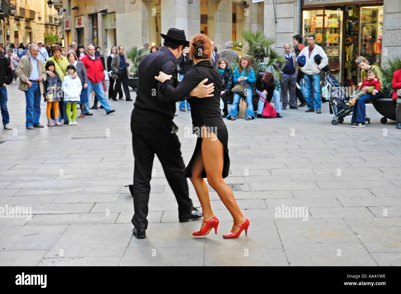 Couple dancing Tange in the street in front of an audience, gothic quarter, Barcelona, Catalonia, Spain Stock Photo
