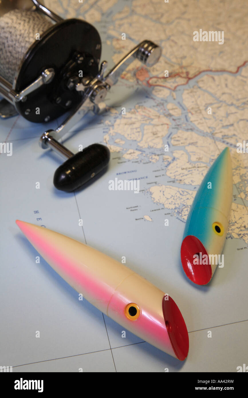 Salmon fishing concept image of trolling plugs and reel on map of B C